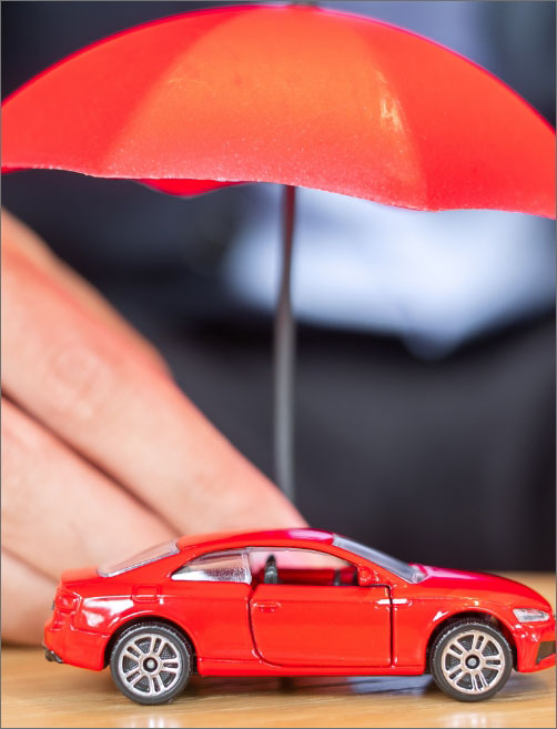 a car with an orange umbrella